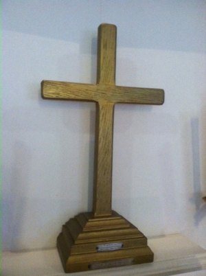 The cross was made by Homer Howard, and painted gold by his wife, Aliph. It's the only other known remnant of the Caribsea, and is displayed in memory of James Baum Gaskill.